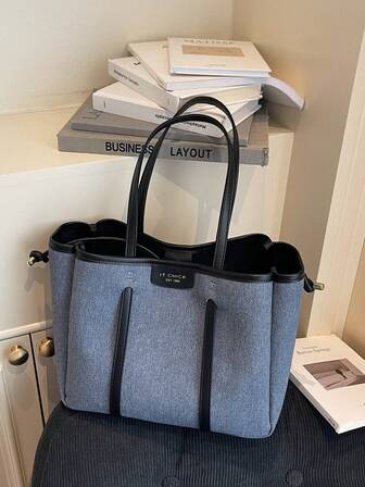 Damväska med en axelrem och färgblock, moderiktig hinkväska med bältesdekor och stor kapacitet