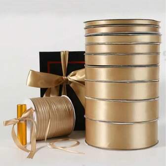 1卷纯金色缎带，宽度分别为1厘米/2.5厘米/4厘米。适用于礼品包装、手工制作、蝴蝶结、花环、婚礼派对装饰及其他缝纫项目。