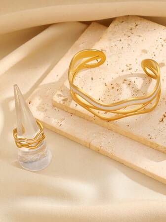 两件套时尚简约个性化镂空曲线渐变滴釉开口戒指和手链套装，适合女性日常佩戴和参加派对，是馈赠佳品。