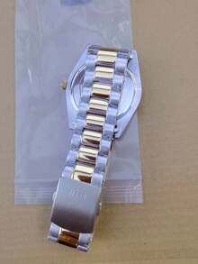 Guess GW0265G8 Klassisch elegante Herren Analog Quarz Uhr mit Tag-/Datumsfunktion, grünes rundes Zifferblatt und zweifarbiges Edelstahlarmband in Silber und Gold, geeignet für den täglichen Businesswear, Geburtstagsgeschenk für Männer