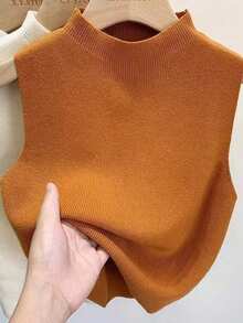 一件女士无袖插肩针织毛衣上衣，领子可拆卸，撞色设计，颜色包括黑色、白色、米色、灰色、粉色和绿色，适合圣诞节装饰穿着