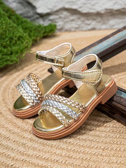 A Pair Of Gold Fashionable Baby Girl Sandals With Woven Straps, Comfortable And Versatile Children's Sandals Suitable For Summer