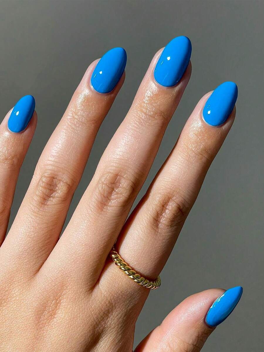 Bộ 24 miếng dán móng tay hình bầu dục màu xanh bóng, chất liệu acrylic, kích thước ngắn, vừa vặn hoàn hảo với móng giả, bao gồm: 1 lọ sơn gel và 1 dũa móng, thích hợp cho phụ nữ và các bạn gái sử dụng hàng ngày khi đi làm, học tập và dự tiệc. - Màu xanh lam - Xem 1
