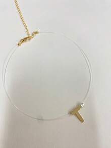 Colar Letra T em Ouro 18k com Pérola – Fio de Nylon Invisível - Dourado - Visão 3