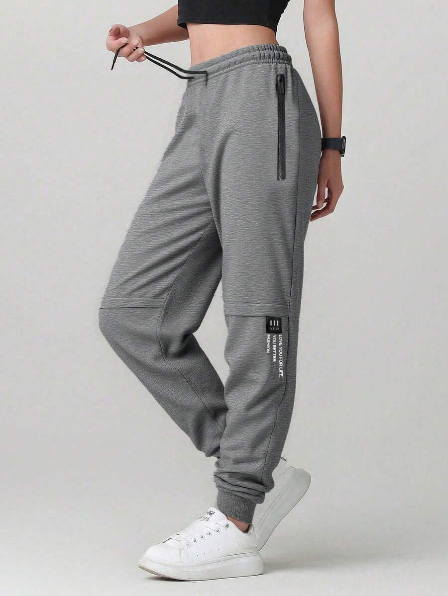 Quần nữ màu trơn, có túi và khóa kéo, kiểu dáng tối giản, thoải mái, phù hợp cho mùa xuân, thu và hè.