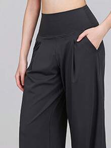 Quần yoga ống rộng chất liệu nylon lụa co giãn cao, nhanh khô, cạp cao, dáng rộng, có túi đựng điện thoại, thích hợp cho nữ tập luyện thể thao. - màu đen - Xem 4