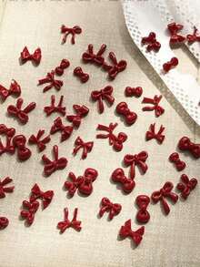 Bộ 50 phụ kiện trang trí móng tay hình nơ hồng, bao gồm nơ và ruy băng nhỏ, thích hợp cho các bé gái tự làm đồ trang trí, có thể dùng làm phụ kiện móng tay. - Đỏ - Xem 2