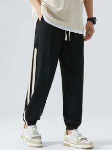 Casual Loose Fit Jogger Pants With Back Pockets, Side Seam Contrasting Stripes And Comfortable Ribbed Cuffs