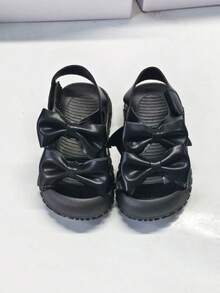 Dép xăng đan đế bằng cho bé sơ sinh, có khóa dán và nơ, chống đá chân. - màu đen - Xem 1