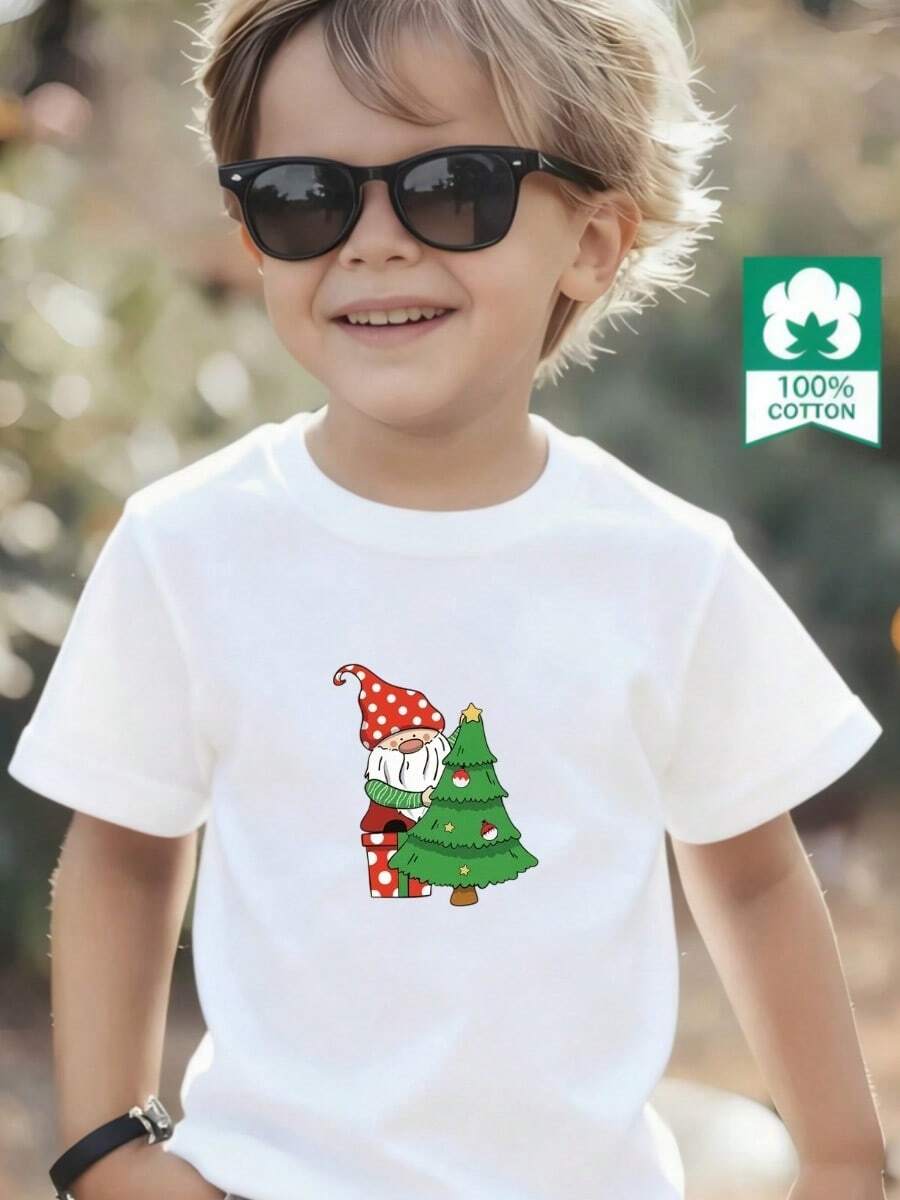 Esta nueva camiseta de manga corta para niño está hecha 100 % de algodón y luce un elegante estampado navideño. Es informal y versátil. Su tejido suave y agradable al tacto cuida la delicada piel de los niños, permitiéndoles moverse con libertad y sentirse cómodos durante reuniones familiares, eventos escolares o juegos al aire libre. - Blanco - Ver 1