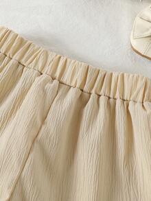 Set de 2 piezas de top de manga corta y shorts de unicolor suave y cómodo con decoración de lazo en tela arrugada para niñas, adecuado para uso al aire libre, primavera/verano - Albaricoque - Ver 8