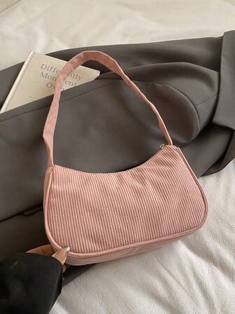 1 st. handväska i enfärgat manchestermaterial med dragkedja och trendig axelrem