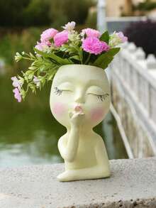 这款造型独特的脸部花盆是室内植物栽培的理想之选。它小巧可爱，底部设有排水孔，可种植多肉植物。除了适合室内植物，它还可以用作花瓶或室内装饰品。 - 彩色 - 查看 6