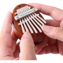 Piano de pulgar Kalimba mini de 8 teclas con colgante, piano de dedo delicado como decoración, adecuado como regalo de Navidad para principiantes