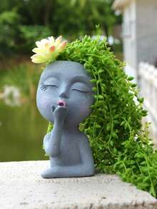 这款造型独特的脸部花盆是室内植物栽培的理想之选。它小巧可爱，底部设有排水孔，可种植多肉植物。除了适合室内植物，它还可以用作花瓶或室内装饰品。 - 彩色 - 查看 4