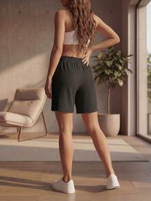 DEVIT - Short 3/4 negro para mujer estilo casual, tela rib acanalada elástica, pretina ancha sin jareta ni bolsillos, diseño básico cómodo y versátil hasta la rodilla ideal para outfits diarios, deportivos o de descanso - Negro - Ver 6