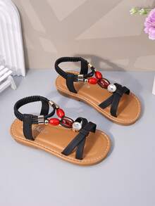 1双黑色哑光软皮女童沙滩凉鞋，交叉绑带设计，饰有闪亮红宝石水钻，后跟配有弹性踝带，圆头，防滑软底，公主风平底凉鞋，适合3-12岁女孩，日常、海滩、学校、度假皆宜，2026春夏款。 - 黑色 - 查看 5