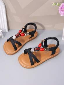 1双黑色哑光软皮女童沙滩凉鞋，交叉绑带设计，饰有闪亮红宝石水钻，后跟配有弹性踝带，圆头，防滑软底，公主风平底凉鞋，适合3-12岁女孩，日常、海滩、学校、度假皆宜，2026春夏款。 - 黑色 - 查看 7