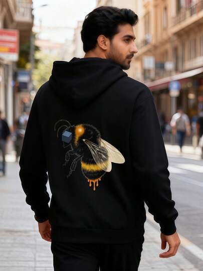 Schwarzer Hoodie mit Hummel-Illustration auf der Rückseite - Detailliertes Bienendesign (schwarzer Körper, gelbe Streifen, weiße & schwarze Flügel, orangefarbener leuchtender Fleck,ürfel im Bein) + orangefarbener Tropf - klassischer Kordelzug-Hoodie, lange Ärmel, lässiger Streetwear-Stil für den Alltag