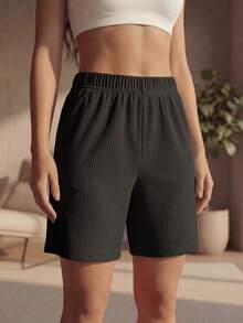 DEVIT - Short 3/4 negro para mujer estilo casual, tela rib acanalada elástica, pretina ancha sin jareta ni bolsillos, diseño básico cómodo y versátil hasta la rodilla ideal para outfits diarios, deportivos o de descanso - Negro - Ver 9