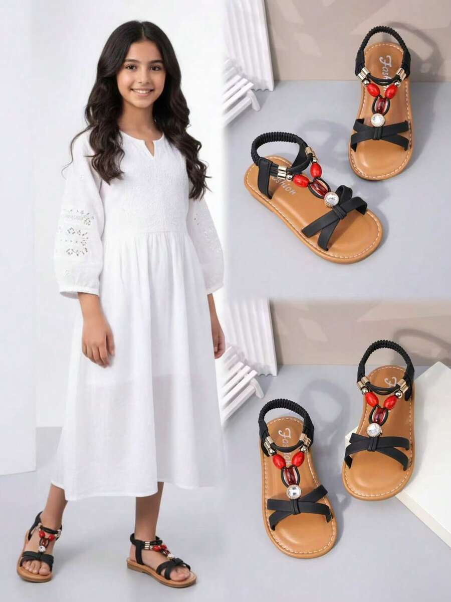 1 Pair Black Matte Soft Leather Toddler Girls' Beach Sandals With Criss-Cross Straps & Sparkling Ruby Rhinestone Decor, Elastic Back Ankle Strap, Round Toe, Non-Slip Soft Sole, Princess Style Flat Sandals, Suitable For 3-12 Years Old Girls, Daily, Beach, School, Holiday, Spring/Summer 2026 - Black - View 1