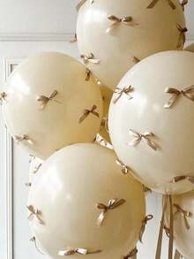 92件/套香槟色气球蝴蝶结装饰套装，柔和优雅的色调，适用于婚礼、生日、周年纪念、摄影背景和节日派对装饰。气球散发着柔和的光泽和温暖的金色调，营造出浪漫奢华的氛围，适合各种场景背景。 - 沙白 - 查看 6