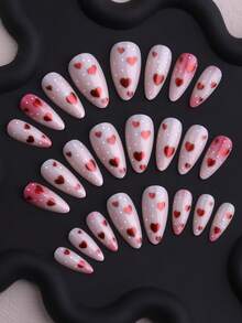 24 akrylowe naklejki na paznokcie z motywem walentynkowym, minimalistyczny wzór z czerwonymi serduszkami i białymi kropkami. W zestawie 1 klej i 1 pilnik do paznokci. Naklejki na paznokcie w kształcie migdałów, średniej długości, odpowiednie do noszenia na co dzień, na zajęcia na świeżym powietrzu, imprezy i inne okazje, idealne dla dziewczyn i kobiet.