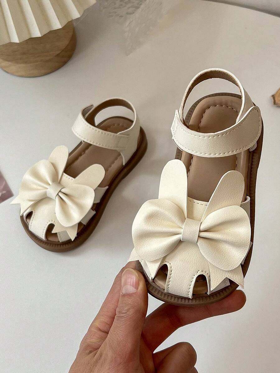 2026 New Girls Bowknot Hollow Out Decor Soft Non-Slip Wear-Resistant Open Toe Lace-Up Flat Sandals, Suitable For Summer Picnics, Daily Outings And School Activities - Beige - View 1