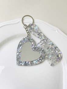 这款心形化妆镜钥匙扣，饰有闪亮粉末和亮片，男女皆宜，可用作车钥匙扣、钥匙圈或礼物。佩戴舒适，是日常休闲装扮的理想配饰。它还可以用作吊坠、手机链、汽车饰品、钥匙扣或包包装饰。是送给女友、家人、老师、参加聚会和生日的完美礼物之选。 - 彩色 - 查看 11