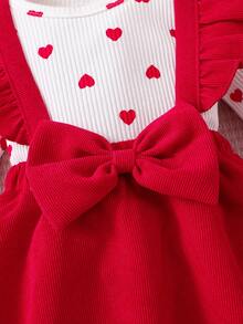 This Baby's Spring/Summer Outfit Features A Triangle Bodysuit With A Pinafore Dress. The Inner Layer Is Covered In Heart Patterns, While The Outer Pinafore Dress Is Adorned With A Large Bow And Layered Ruffles At The Shoulders. Paired With A Matching Headband, It's Perfect For Valentine's Day, Family Gatherings, Or Everyday Outings. - Red - View 6