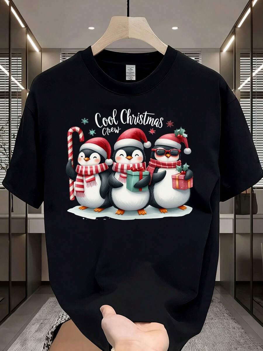 Camiseta de Hombre con Patrón de Pingüino y Bastón de Caramelo de Navidad - Camiseta Ligera, Transpirable y Resistente a las Arrugas con Cuello Redondo y Caja de Regalo, Estampado de Acebo, Adecuada para Todas las Estaciones, Atuendo Casual para Fiestas - Negro - Ver 1