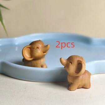 2 st snidade elefantfigurer i trä - handgjorda, lämpliga för jul, nyår och högtidsdekorationer