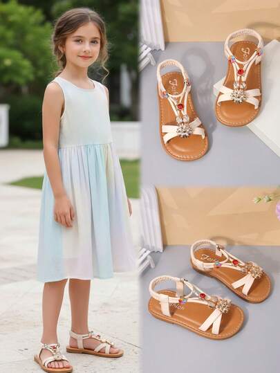 Dép xăng đan đế bằng màu be cho bé gái, đế PU mềm mại, họa tiết hoa hướng dương màu đỏ ruby, kiểu dáng xỏ chân, mũi tròn, chống trơn trượt, nhẹ, dép đi biển kiểu La Mã dễ thương phù hợp cho bé gái từ 3-15 tuổi, thích hợp đi chơi, đi biển, mặc hàng ngày, mùa xuân/hè.