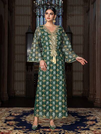 This Elegant Floor-Length Formal Dress For Women Features A V-Neck Design, Wide Flare Sleeves, Intricate Embroidery, A Fringed Waist Belt, And A Geometric Patterned Fabric - Making It An Ideal Choice For Weddings, Formal Galas, Awards Ceremonies, And Red Carpet Events.
