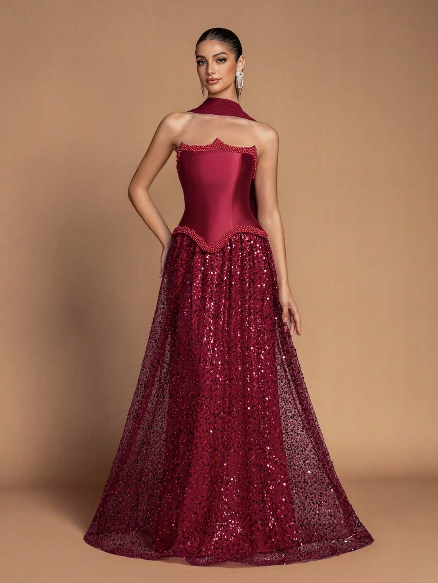 This Elegant Strapless Fitted Waist Long Evening Gown, Adorned With Beaded Embellishments, Features A Back Tie Design, And Comes With A Matching Shawl And Flowing Glittery Mesh Maxi Skirt - Making It An Ideal Choice For Weddings, Formal Galas, Awards Ceremonies, And Red Carpet Events. - Burgundy - View 1