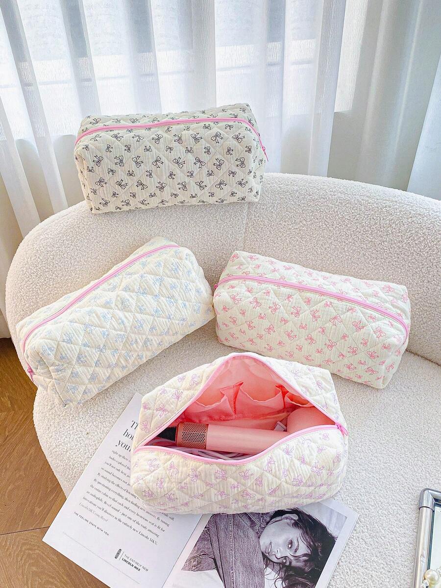 1个绗缝蝴蝶结美发工具收纳包，蝴蝶结吹风机收纳包，多口袋大容量美发工具旅行收纳包，旅行箱旅行携带整理包，吹风机收纳包，直发器收纳包，卷发棒旅行收纳包，造型器及配件收纳包，化妆包