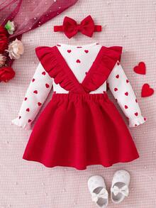 This Baby's Spring/Summer Outfit Features A Triangle Bodysuit With A Pinafore Dress. The Inner Layer Is Covered In Heart Patterns, While The Outer Pinafore Dress Is Adorned With A Large Bow And Layered Ruffles At The Shoulders. Paired With A Matching Headband, It's Perfect For Valentine's Day, Family Gatherings, Or Everyday Outings. - Red - View 2