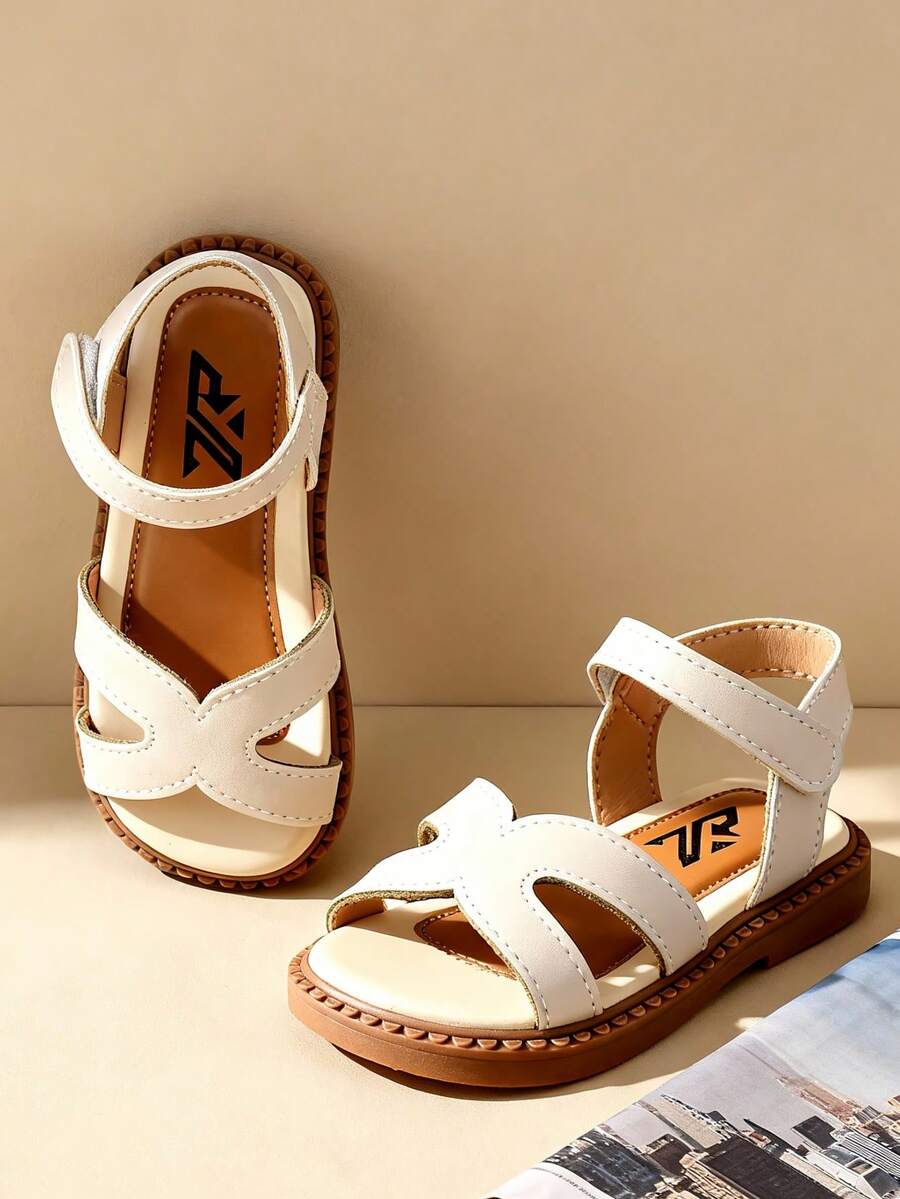 2026 Spring & Summer Minimalist Toddler Girls' 3-12 Years Old Soft Bottom Prewalker Shoes, Geometric Hollow Criss-Cross Design, Skin-Friendly Breathable Genuine Leather, Non-Slip Shock-Absorbing Open Toe Adjustable Hook And Loop Ankle Strap Flat, Fresh Minimalist Fashion Children Sandals For School, Daily, Outdoor, Versatile Occasions - Beige - View 1