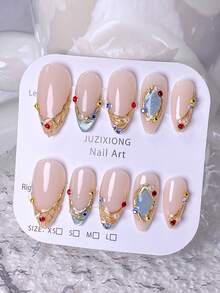 10片手工制作的按压式美甲贴纸，短款，有红色、蓝色、金色可选，可爱风格，奢华美感，饰有闪亮的蓝色猫眼法式美甲，点缀着蓝色和红色水钻，梦幻飘逸，包含美甲工具套装，易于粘贴和卸除，可重复使用，适合女性和女孩的杏仁形指甲。 - 淺藍色 - 查看 3