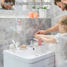 优雅侧装式眼镜架，简约黑色设计，时尚桌面或床头收纳方案，是节日、圣诞节、新年礼物的理想之选，也是桌面配件、时尚眼镜架的理想之选，采用塑料材质，可作为桌面眼镜架或桌面收纳架使用。 - 彩色 - 查看 12