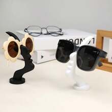 优雅侧装式眼镜架，简约黑色设计，时尚桌面或床头收纳方案，是节日、圣诞节、新年礼物的理想之选，也是桌面配件、时尚眼镜架的理想之选，采用塑料材质，可作为桌面眼镜架或桌面收纳架使用。 - 彩色 - 查看 4