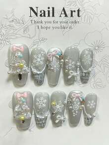 10 piezas de uñas postizas blancas románticas de Navidad hechas a mano con lazos dulces, perlas, diseños de hadas delicadas, copos de nieve y ojos de gato brillantes. Incluye 1 hoja de pegatinas de gelatina y 1 lima de uñas.