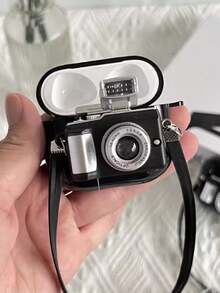 1个创意卡通黑色相机TPU保护壳，兼容苹果1/2/3蓝牙耳机