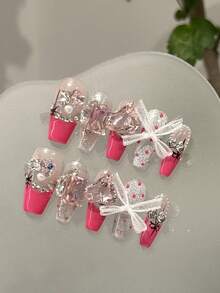 Bộ 10 móng tay giả acrylic hình quan tài, móng dài tự làm, màu hồng tươi với màu tương phản và trang trí đá pha lê trong suốt, nơ 3D thêm phần ngọt ngào; Bộ móng đính đá lấp lánh này vừa ngọt ngào vừa thời trang, phù hợp cho phụ nữ diện trong các dịp cưới hỏi, tiệc tùng, lễ hội, và cũng là một món quà nghệ thuật làm móng tuyệt vời. - Nhiều màu - Xem 4