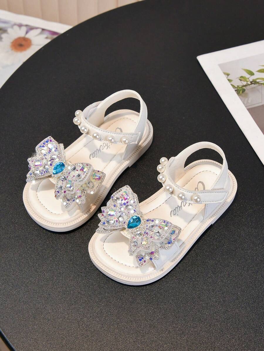 1双新款时尚彩色撞色蝴蝶结可爱休闲平底凉鞋，适合女婴和幼儿