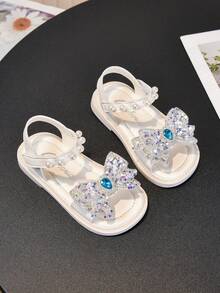 1双新款时尚彩色撞色蝴蝶结可爱休闲平底凉鞋，适合女婴和幼儿