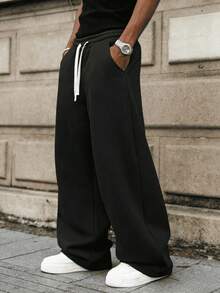 男士宽松休闲纯色阔腿裤，带抽绳腰带和大口袋，适合日常行走、工作、旅行和其他场合。