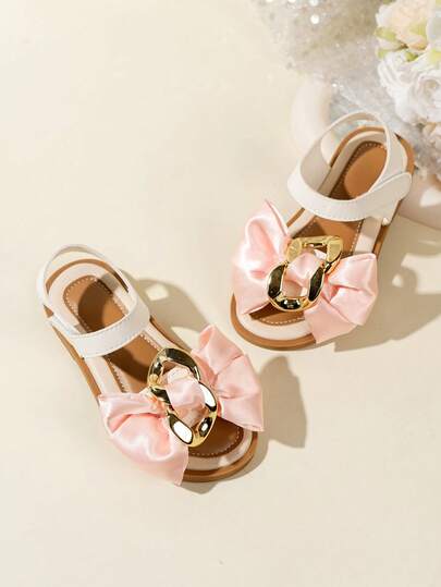 1双儿童粉色蝴蝶结金色搭扣装饰魔术贴凉鞋 - 舒适百搭，是购物、日常穿着、派对和夏季旅行的理想之选。时尚、休闲、舒适的女童凉鞋