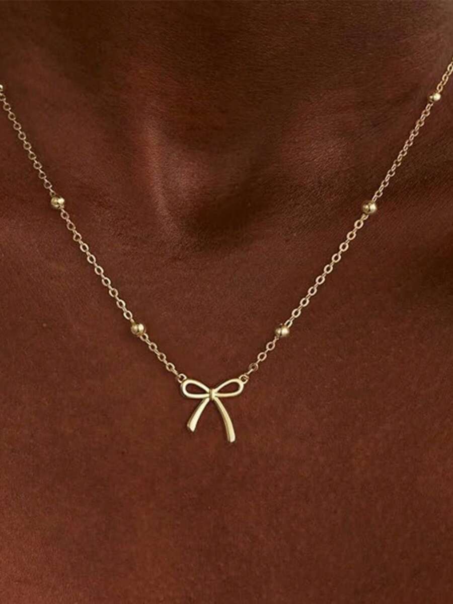 1 Elegante y encantador collar con colgante de lazo chapado en oro, un sencillo y adorable collar versátil para mujer, un collar con colgante de lazo minimalista y de moda. - Dorado - Ver 1