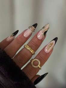 10片手工杏仁形黑色法式香槟色美甲贴纸。这款美甲贴纸采用手绘不对称黑色法式美甲图案，并镶嵌香槟色水钻，简约时尚，尽显优雅浪漫。适合日常佩戴、约会、音乐会和轻商务场合，是送给女性和女孩的绝佳礼物。 - 彩色 - 查看 2